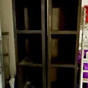 Two tall 8 feet shelves, brown color, homemade, and never used!